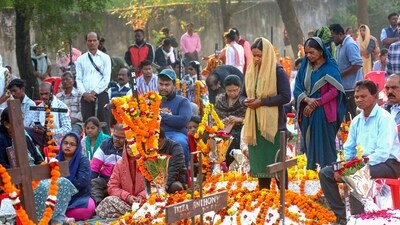 People from the Christian community visit a cemetery as they observe All Souls' Day and pray for their deceased loved ones in Bhopal. (PTI)