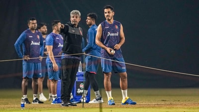 Afghanistan players with team's mentor Ajay Jadeja during a practice session on the eve of their ICC Men's World Cup ODI cricket match against Netherlands. (PTI) Afghanistan players with team's mentor Ajay Jadeja during a practice session on the eve of their ICC Men's World Cup ODI cricket match against Netherlands. (PTI)