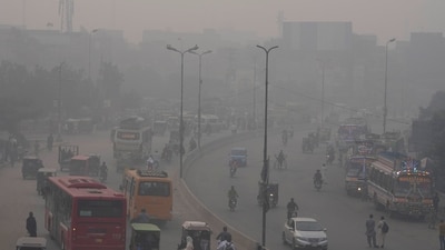 Traffic moves on a road as smog envelops areas of Lahore, Pakistan. (AP) Traffic moves on a road as smog envelops areas of Lahore, Pakistan. (AP)