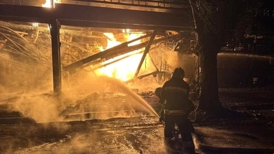 Firefighters work at an oil refinery which was hit during Russia's drone attacks in Kremenchuk, Poltava region, Ukraine. (Reuters)