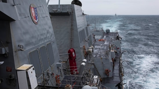 The Arleigh Burke-class guided-missile destroyer USS Ralph Johnson (DDG 114) conducts routine underway operations in the Taiwan Strait. (AP)