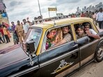 A photograph from the 'Goodbye Padmini' series shows devotees transporting a Ganesha idol to Girgaum Chowpatty for immersion during the Ganesh festival in 2010.  
