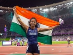 India's Jyothi Yarraji celebrates after winning silver medal in the women's 100-meter hurdles final event at the 19th Asian Games, in Hangzhou