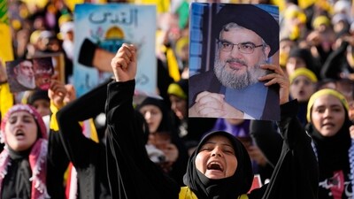 Supporters of the Iranian-backed Hezbollah group shout slogans, as they wait the speech of Hezbollah leader Sayyed Hassan Nasrallah, during a rally in Beirut, Lebanon, on November 3. (AP) Supporters of the Iranian-backed Hezbollah group shout slogans, as they wait the speech of Hezbollah leader Sayyed Hassan Nasrallah, during a rally in Beirut, Lebanon, on November 3. (AP)