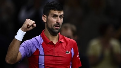 Serbia's Novak Djokovic celebrates after winning his men's singles match against Netherlands' Tallon Griekspoor (AFP)
