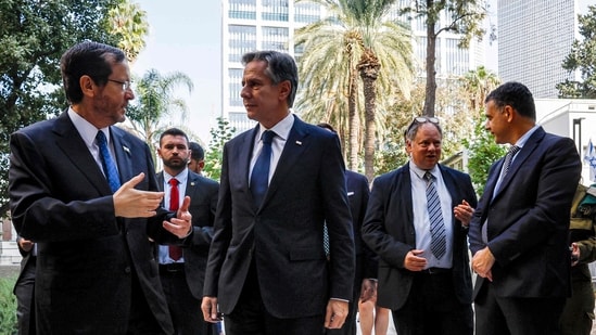 US Secretary of State Antony Blinken (C) meets with Israeli President Isaac Herzog (L) at the Ben-Gurion House on the Kirya military base in Tel Aviv (AFP)