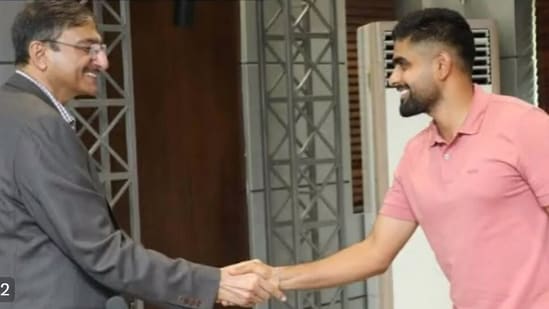 PCB chief Zaka Ashraf shaking hands with Pakistan captain Babar Azam