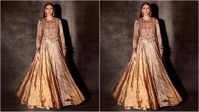 Her outfit comes in copper tones and features a short neckline and full sleeves. The mesmerising hand embroidery and intricate detailing adorned the top of her kurta while the bottom has a beautifully flared hem. (Instagram/@aditiraohydari) Her outfit comes in copper tones and features a short neckline and full sleeves. The mesmerising hand embroidery and intricate detailing adorned the top of her kurta while the bottom has a beautifully flared hem. (Instagram/@aditiraohydari)