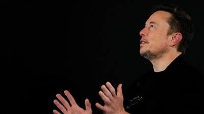 Tesla and SpaceX's CEO Elon Musk reacts during an in-conversation event with British Prime Minister Rishi Sunak in London, Britain, November 2, 2023. (via REUTERS)