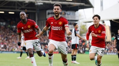 Manchester United's Bruno Fernandes, centre, celebrates after scoring his side's opening goal during the English Premier League soccer match between Fulham and Manchester United (AP) Manchester United's Bruno Fernandes, centre, celebrates after scoring his side's opening goal during the English Premier League soccer match between Fulham and Manchester United (AP)