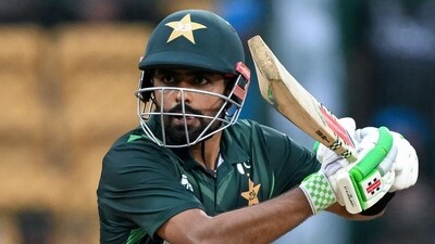 Pakistan's captain Babar Azam plays a shot during the 2023 ICC Men's Cricket World Cup one-day international (ODI) match between New Zealand and Pakistan at the M. Chinnaswamy Stadium in Bengaluru on November 4, 2023. (Photo by Sajjad HUSSAIN / AFP) / -- IMAGE RESTRICTED TO EDITORIAL USE - STRICTLY NO COMMERCIAL USE -- (AFP) Pakistan's captain Babar Azam plays a shot during the 2023 ICC Men's Cricket World Cup one-day international (ODI) match between New Zealand and Pakistan at the M. Chinnaswamy Stadium in Bengaluru on November 4, 2023. (Photo by Sajjad HUSSAIN / AFP) / -- IMAGE RESTRICTED TO EDITORIAL USE - STRICTLY NO COMMERCIAL USE -- (AFP)