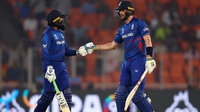 Chris Woakes in action with Adil Rashid after he hit six runs (REUTERS)