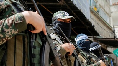 Palestinian militants attend Hamas rally Solidarity with Al-Aqsa in Jabalia in northern Gaza April 7, 2023. (Reuters)