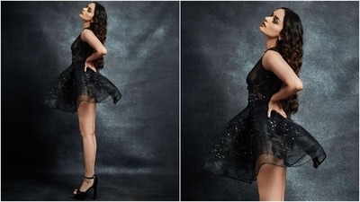 Manushi black dress features a micro-mini hem length, a see-through silhouette, shimmering sequin embellishments done in floral patterns, a round neckline, a fitted bust, cinched waistline, and a layered tulle skirt. The former Miss World wore it with black stilettos featuring killer high heels. (Instagram) Manushi black dress features a micro-mini hem length, a see-through silhouette, shimmering sequin embellishments done in floral patterns, a round neckline, a fitted bust, cinched waistline, and a layered tulle skirt. The former Miss World wore it with black stilettos featuring killer high heels. (Instagram)