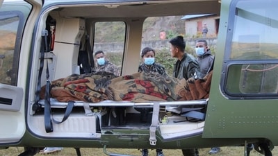 An injured person is seen inside a helicopter after an earthquake in Jajarkot, Nepal. (REUTERS)