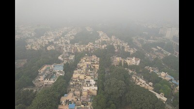 The city skyline is enveloped by smog and fog in New Delhi, on Saturday. (AP)
