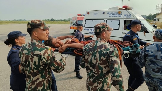 Helicopters and ground troops rushed to help people hurt in a strong earthquake that shook northwestern Nepal districts just before midnight Friday, killing more than hundred people and injuring dozens more, officials said Saturday.(AP)