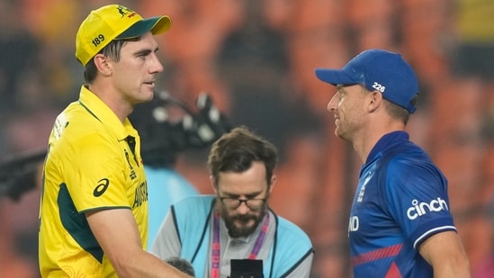 Jos Butler greets Pat Cummins after the latter won their ICC Men's Cricket World Cup match in Ahmedabad(AP)