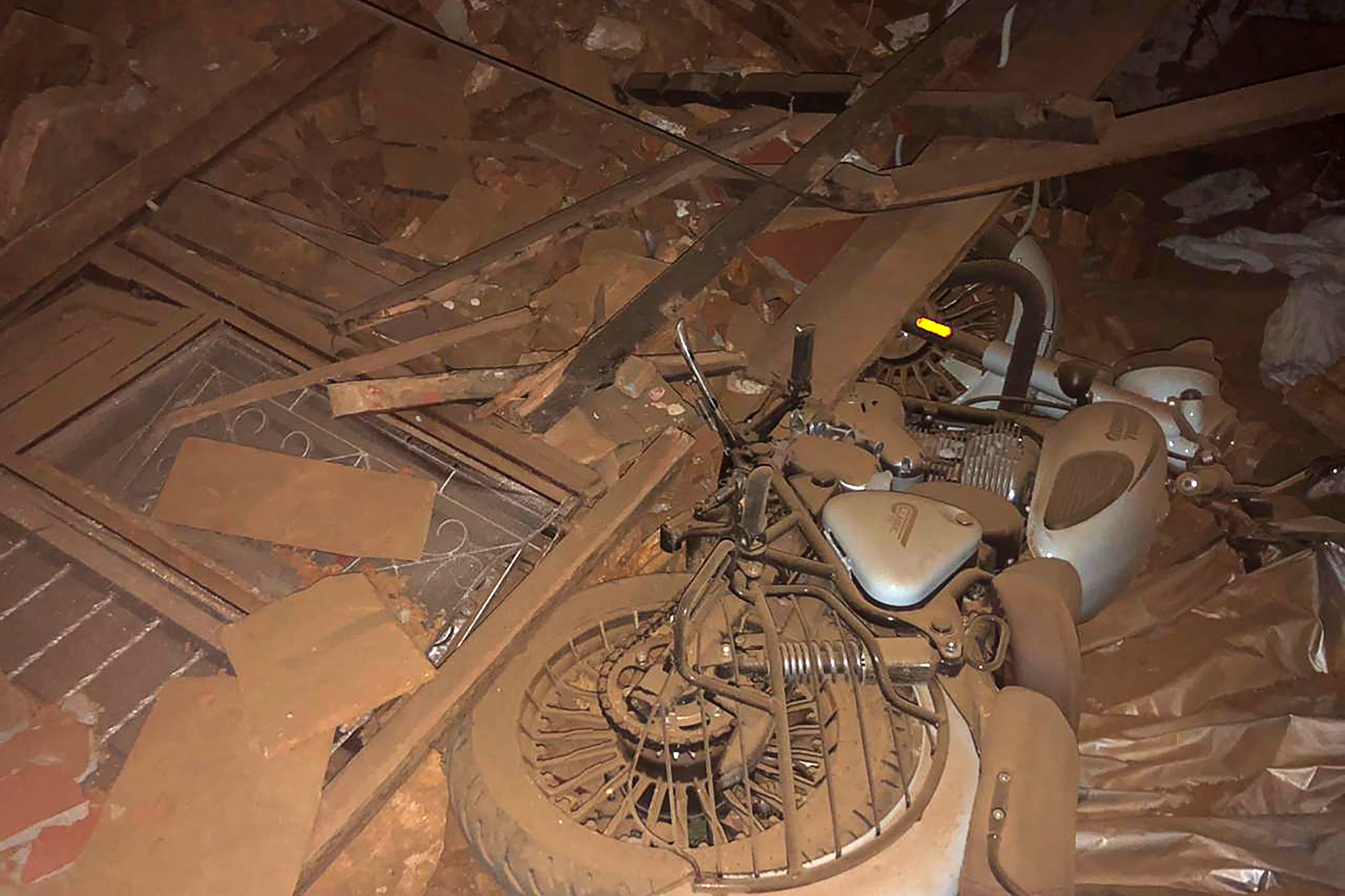 A motorcycle and broken windows are seen in the midst of the rubble in the aftermath of an earthquake in Jajarkot on November 4, 2023. (AFP) A motorcycle and broken windows are seen in the midst of the rubble in the aftermath of an earthquake in Jajarkot on November 4, 2023. (AFP)