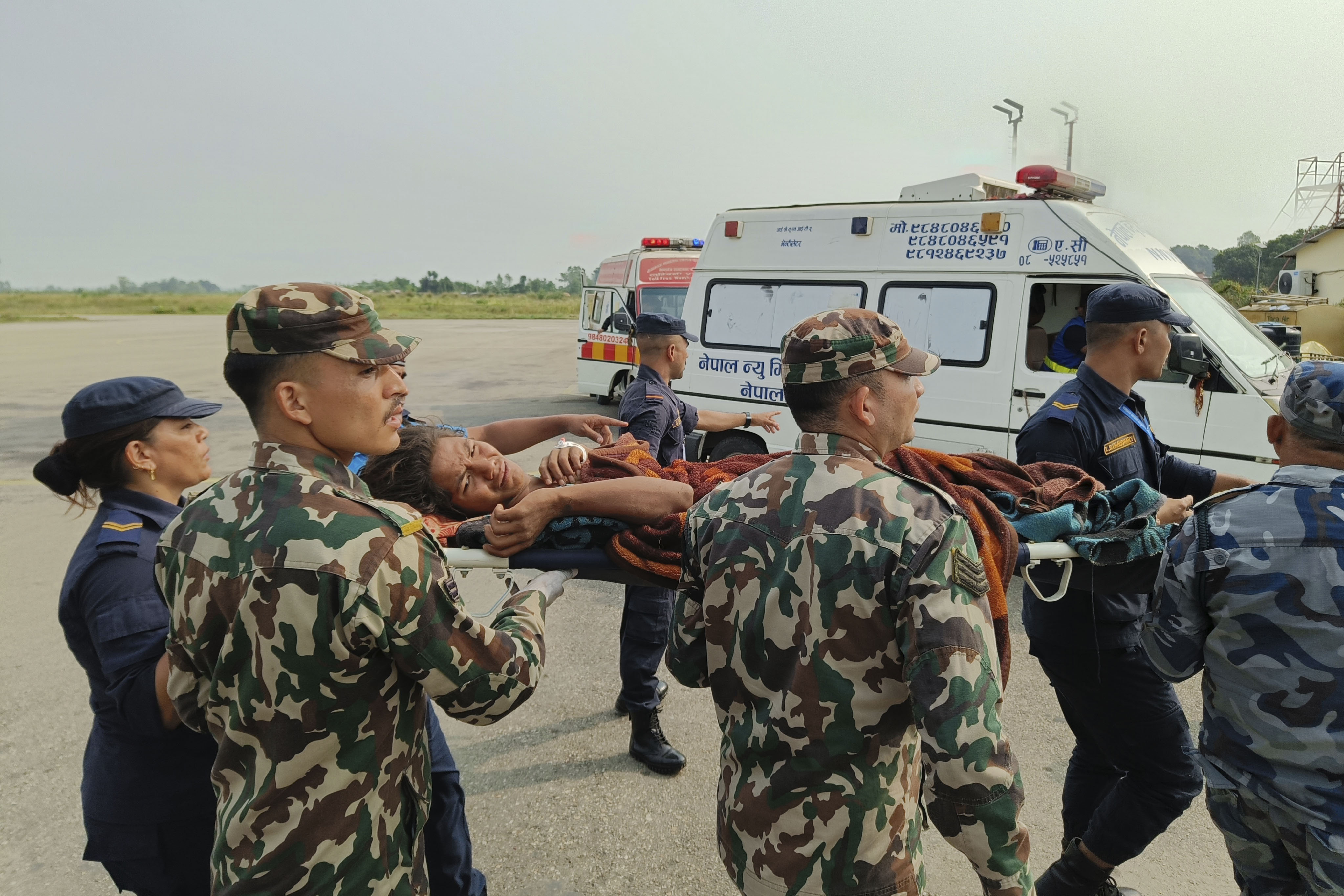 A woman airlifted from an earthquake-affected area is carried on a stretcher in Nepalgunj, Nepal on Saturday. (AP) A woman airlifted from an earthquake-affected area is carried on a stretcher in Nepalgunj, Nepal on Saturday. (AP)