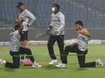 Sri Lanka players practice amid evening smog ahead of their match against Bangladesh. Sri Lanka players practice amid evening smog ahead of their match against Bangladesh.