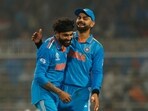 India's Ravindra Jadeja celebrates with Virat Kohli after sending a South Africa cricketer to pavilion. 