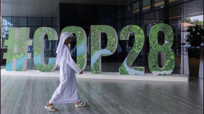 A person walks past a “#COP28” sign during The Changemaker Majlis, a one-day CEO-level thought leadership workshop focused on climate action, in Abu Dhabi, United Arab Emirates, on October 1. (REUTERS) A person walks past a “#COP28” sign during The Changemaker Majlis, a one-day CEO-level thought leadership workshop focused on climate action, in Abu Dhabi, United Arab Emirates, on October 1. (REUTERS)