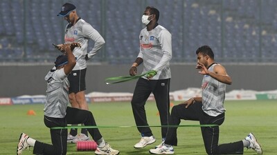 Sri Lanka players practice amid evening smog ahead of their match against Bangladesh. (Shrikant Singh) Sri Lanka players practice amid evening smog ahead of their match against Bangladesh. (Shrikant Singh)