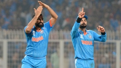 Mohammed Shami and Virat Kohli gesture for a DRS during their match against South Africa in the ICC Men's Cricket World Cup 2023 at Eden Gardens in Kolkata on Sunday. (ANI Photo) Mohammed Shami and Virat Kohli gesture for a DRS during their match against South Africa in the ICC Men's Cricket World Cup 2023 at Eden Gardens in Kolkata on Sunday. (ANI Photo)