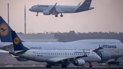 A Lufthansa aircraft lands while two others wait at an airport. (Representative/AP) A Lufthansa aircraft lands while two others wait at an airport. (Representative/AP)