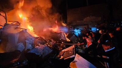 Palestinians try to put out a fire at the site of an Israeli strike on a house in Jabalia refugee camp on the northern Gaza Strip on November 4. (Reuters)