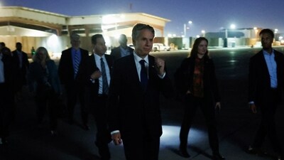 US Secretary of State Antony Blinken walks to board his military transport aircraft to depart Baghdad International Airport. (Reuters)