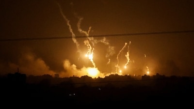 Flares burn in the sky as seen from the Israeli side of the border with Gaza, in southern Israel. (Reuters)