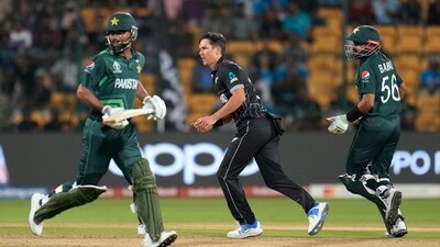 New Zealand's Trent Boult watches as Pakistan's captain Babar Azam and Fakhar Zaman run between wickets (AP)