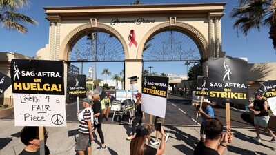 SAG-AFTRA members walk the picket line on the 100th day of their ongoing strike outside Paramount Studios in Los Angeles, California. (REUTERS)