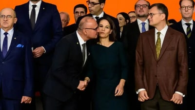 Croatia foreign minister kisses his German counterpart (AFP) Croatia foreign minister kisses his German counterpart (AFP)