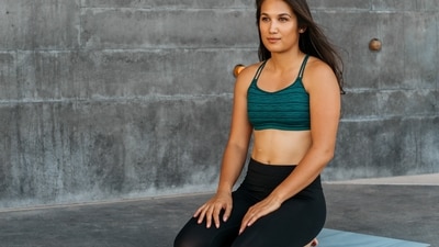 Vajrasana: Kneel down and sit on your heels, ensuring your thighs press against your calf muscles and your heels are joined together. Keep your palms on your knees, facing upward. Straighten your back and gaze forward. (Photo by Tim Chow on Unsplash) Vajrasana: Kneel down and sit on your heels, ensuring your thighs press against your calf muscles and your heels are joined together. Keep your palms on your knees, facing upward. Straighten your back and gaze forward. (Photo by Tim Chow on Unsplash)