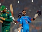Virat Kohli celebrates with Ravindra Jadeja after reaching his 49th century, equalizing with Sachin Tendulkar's record of most number of ODI centuries