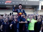 Red Bull's Max Verstappen celebrates after winning the Brazilian Grand Prix with teammates