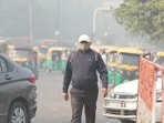A man wears a mask to protect himself from growing level of air pollution in New Delhi on Monday. A man wears a mask to protect himself from growing level of air pollution in New Delhi on Monday.