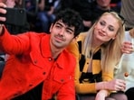 Joe Jonas takes a selfie with Sophie Turner during a break in play of an NBA basketball game in 2019. (File Photo/ AP)