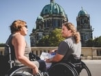 Two tourists in wheelchairs are seen in Berlin