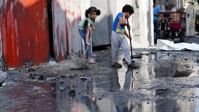 Palestinian children mop outside their home after an Israeli bombardment in the Maghazi refugee camp in the Gaza Strip on Sunday, Nov. 5, 2023. (AP Photo/Hatem Moussa) Palestinian children mop outside their home after an Israeli bombardment in the Maghazi refugee camp in the Gaza Strip on Sunday, Nov. 5, 2023. (AP Photo/Hatem Moussa)