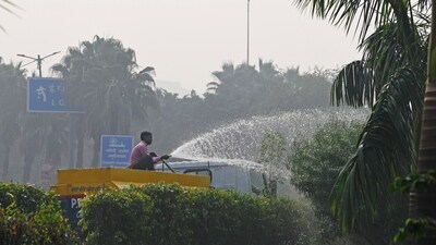 The Delhi Fire Services (DFS) has started sprinkling water at 13 hotspots to curb rising air pollution in the city, officials said on Monday. (ANI) The Delhi Fire Services (DFS) has started sprinkling water at 13 hotspots to curb rising air pollution in the city, officials said on Monday. (ANI)