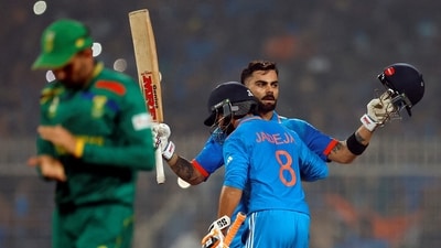 Virat Kohli celebrates with Ravindra Jadeja after reaching his 49th century, equalizing with Sachin Tendulkar's record of most number of ODI centuries (REUTERS)