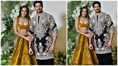 Kiara Advani donned a breathtaking multi-colored lehenga, beautifully accentuated with opulent jewelry, and left her hair flowing freely. Her husband, Sidharth Malhotra, elegantly matched her attire by wearing a black floral sherwani. (HT Photo) Kiara Advani donned a breathtaking multi-colored lehenga, beautifully accentuated with opulent jewelry, and left her hair flowing freely. Her husband, Sidharth Malhotra, elegantly matched her attire by wearing a black floral sherwani. (HT Photo)