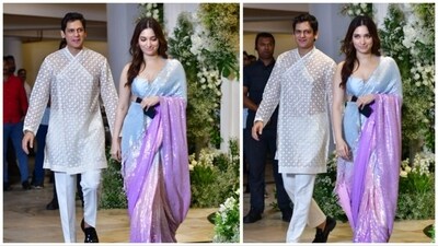 Vijay Varma sported a suave appearance in a sleek white kurta pyjama, while Tamannaah Bhatia exuded charm in a pastel-hued sequined saree. She chose to go for a natural makeup look. (HT Photo) Vijay Varma sported a suave appearance in a sleek white kurta pyjama, while Tamannaah Bhatia exuded charm in a pastel-hued sequined saree. She chose to go for a natural makeup look. (HT Photo)