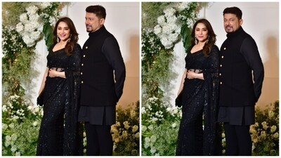 Madhuri Dixit and her husband coordinated their outfits in matching black attire. She wore an embellished saree, while her husband, Dr. Nene, sported a bandhgala set. (HT Photo) Madhuri Dixit and her husband coordinated their outfits in matching black attire. She wore an embellished saree, while her husband, Dr. Nene, sported a bandhgala set. (HT Photo)