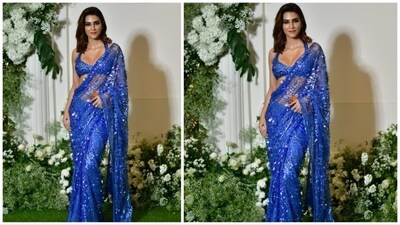 Kriti Sanon donned a beautiful blue sheer saree adorned with sparkling sequins and intricate beaded embellishments for the Diwali celebration. (HT Photo) Kriti Sanon donned a beautiful blue sheer saree adorned with sparkling sequins and intricate beaded embellishments for the Diwali celebration. (HT Photo)