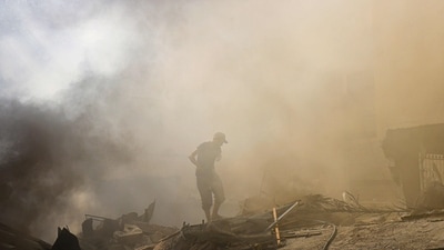 Israel-Hamas War: Palestinians check the rubble of a building in Khan Yunis amid the ongoing battles between Israel and the Palestinian group Hamas. (AFP) Israel-Hamas War: Palestinians check the rubble of a building in Khan Yunis amid the ongoing battles between Israel and the Palestinian group Hamas. (AFP)